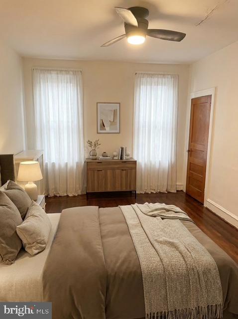 614 Wynnewood Road Philadelphia, PA 19151 - Photo 11 of 15 a bedroom with a large bed and a window