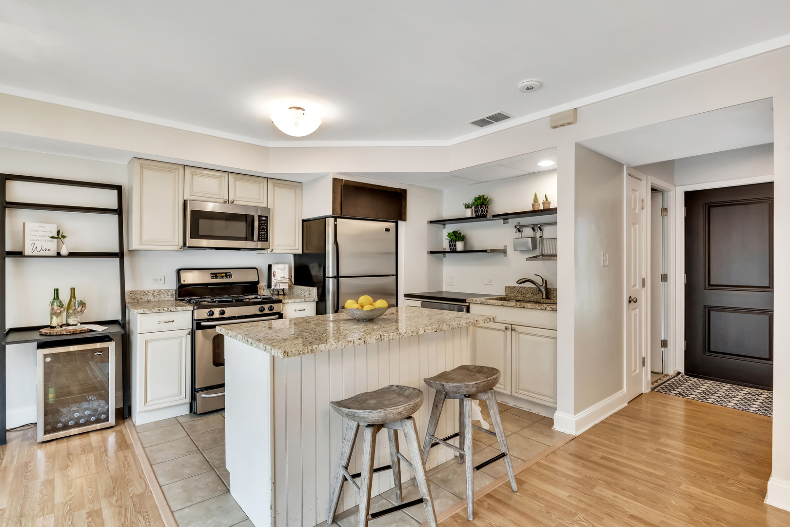 1341 Greenwillow Lane, Unit A Glenview, IL 60025 - Photo 11 of 27 a kitchen with stainless steel appliances a refrigerator stove microwave and sink