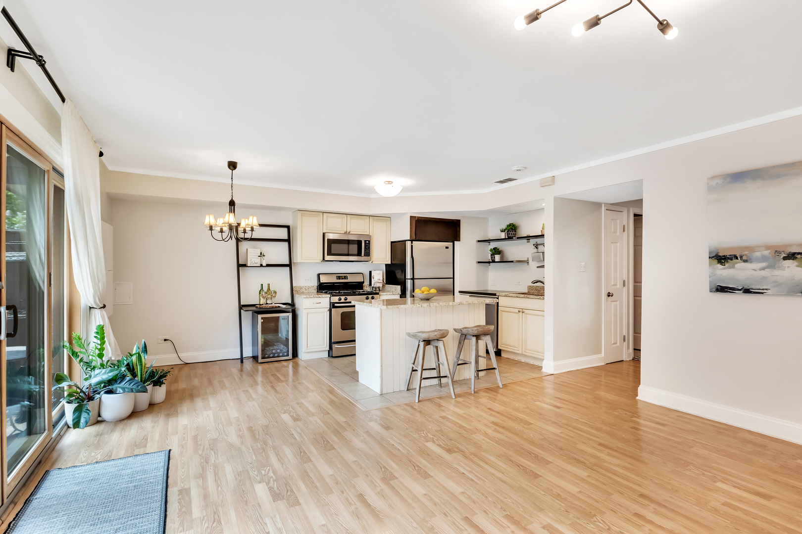 1341 Greenwillow Lane, Unit A Glenview, IL 60025 - Photo 12 of 27 a living room with furniture and a wooden floor