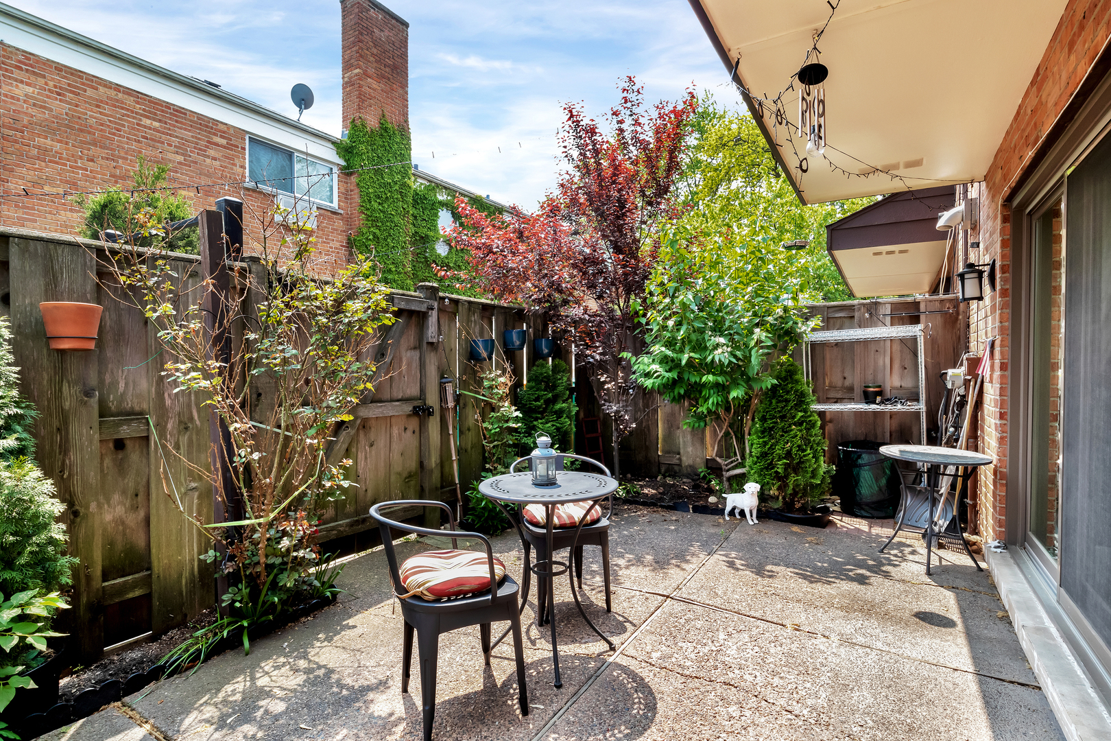 1341 Greenwillow Lane, Unit A Glenview, IL 60025 - Photo 14 of 27 a patio with table and chairs