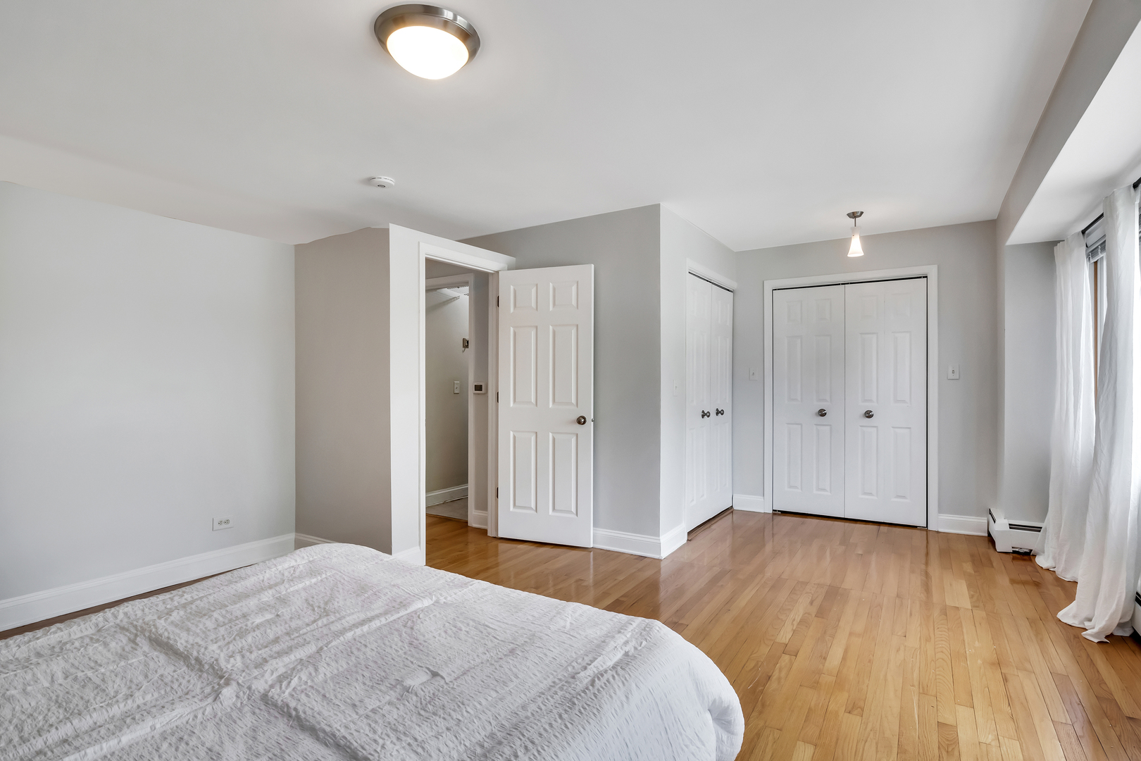 1341 Greenwillow Lane, Unit A Glenview, IL 60025 - Photo 17 of 27 a view of livingroom with wooden floor and window