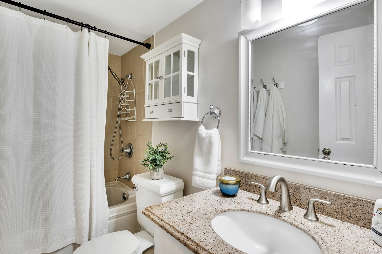 1341 Greenwillow Lane, Unit A Glenview, IL 60025 - Photo 20 of 27 a bathroom with a granite countertop sink and a mirror