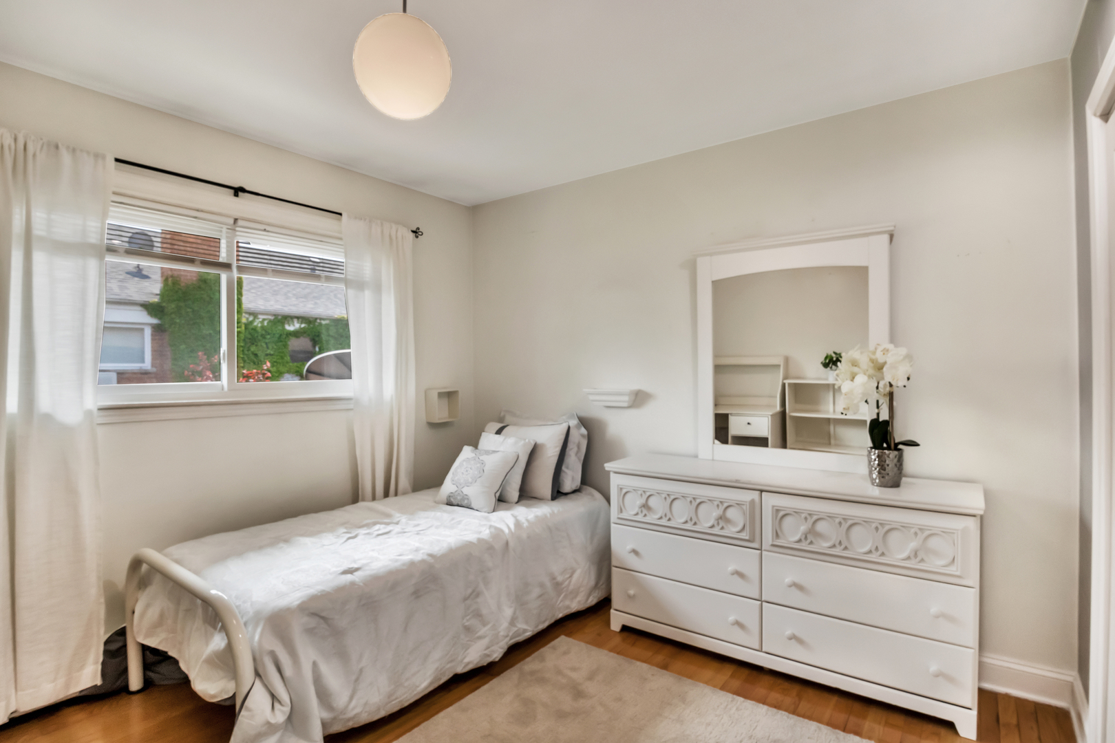 1341 Greenwillow Lane, Unit A Glenview, IL 60025 - Photo 21 of 27 a bedroom with a bed and a window