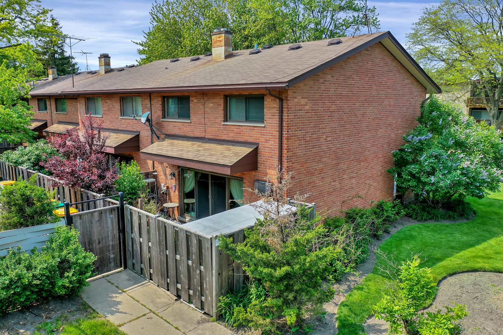 1341 Greenwillow Lane, Unit A Glenview, IL 60025 - Photo 25 of 27 a front view of house with yard and green space