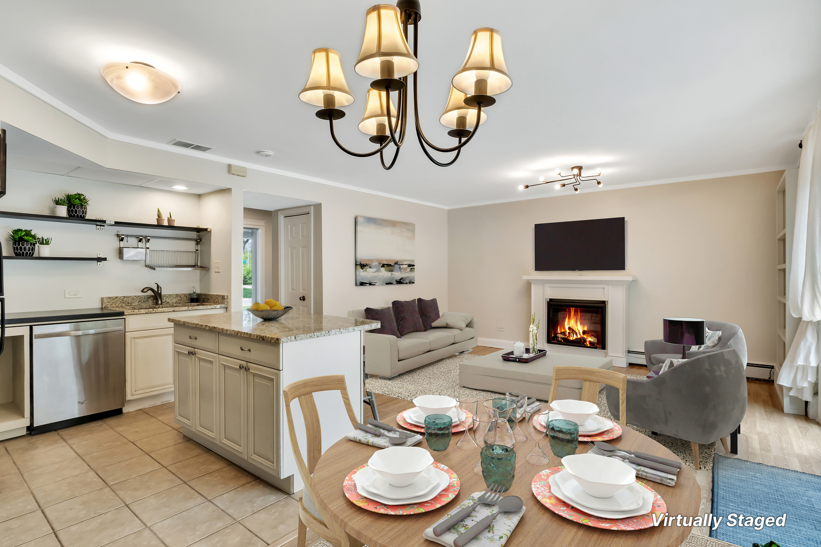1341 Greenwillow Lane, Unit A Glenview, IL 60025 - Photo 4 of 27 a kitchen with stainless steel appliances a fireplace a stove and a dining table with wooden floor