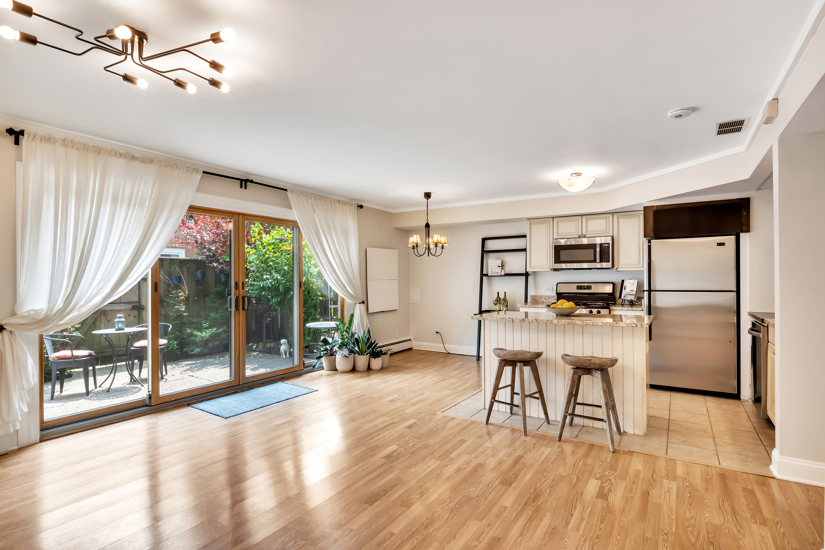 1341 Greenwillow Lane, Unit A Glenview, IL 60025 - Photo 8 of 27 a dining room with furniture and a floor to ceiling window