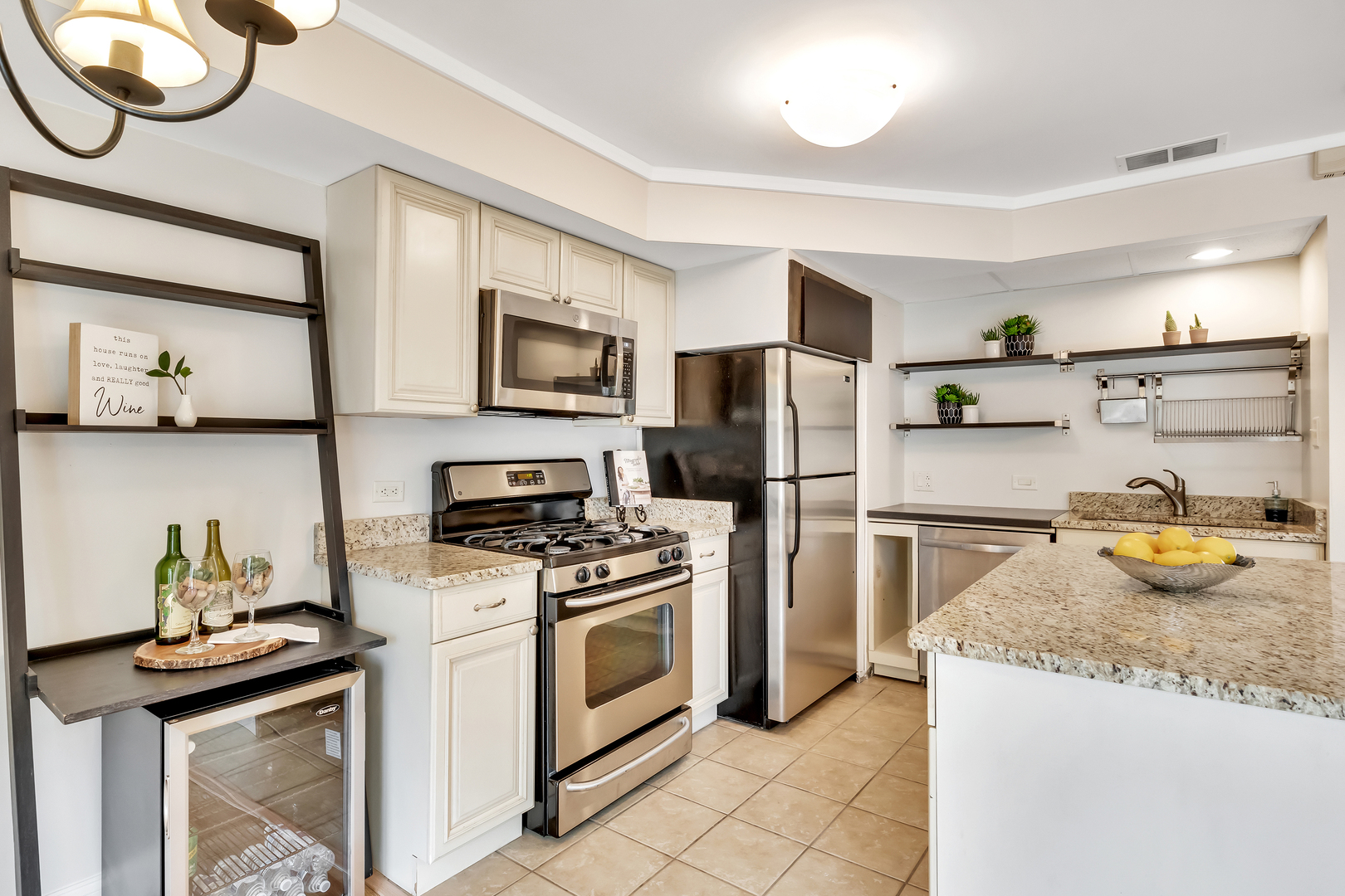 1341 Greenwillow Lane, Unit A Glenview, IL 60025 - Photo 10 of 27 a kitchen with stainless steel appliances granite countertop a sink stove and refrigerator