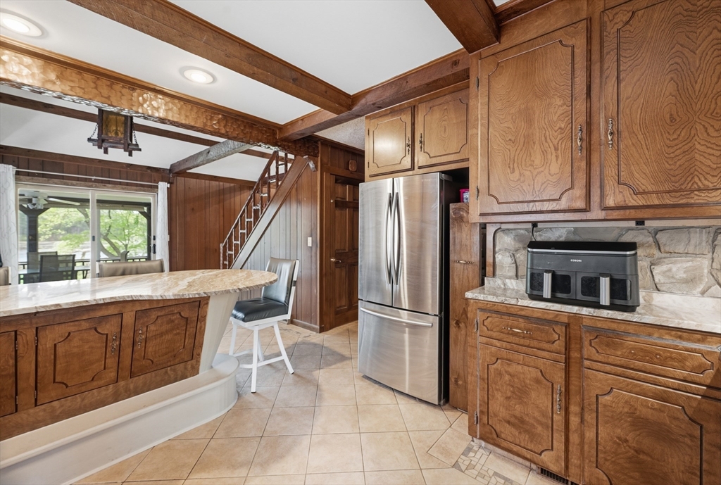 43 Flint Road Tyngsborough, MA 01879 - Photo 8 of 40 a kitchen with stainless steel appliances a refrigerator and a stove top oven