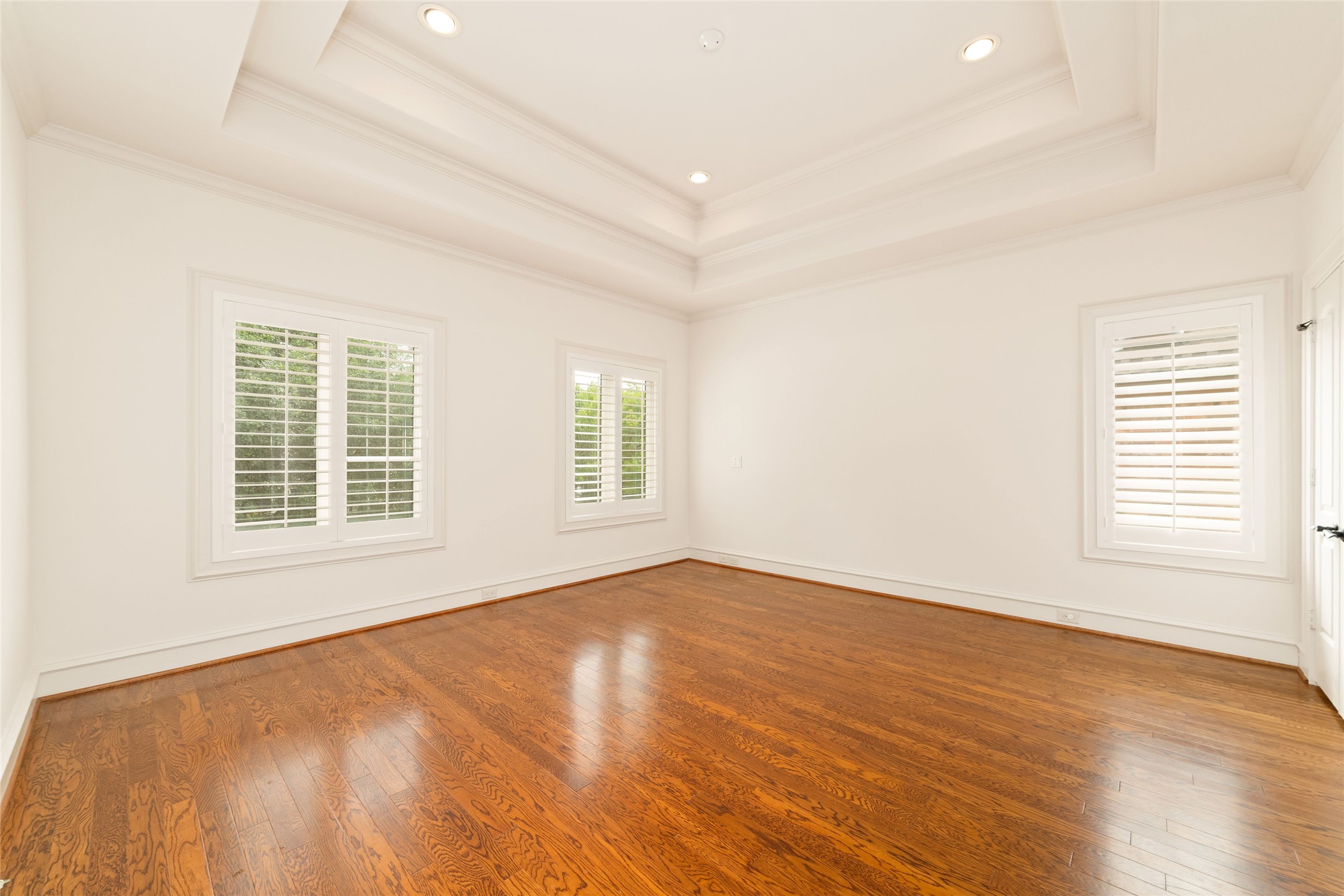4102 Gramercy Street Houston, TX 77025 - Photo 28 of 35 an empty room with wooden floor and windows