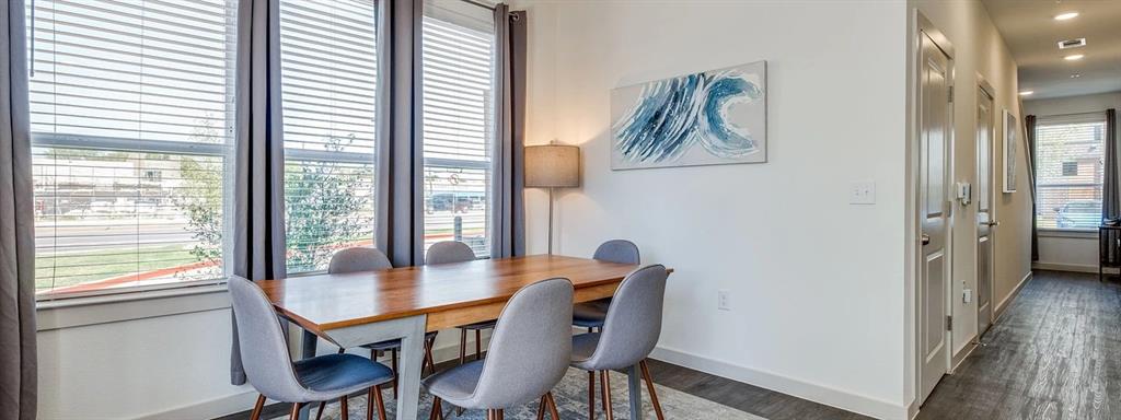 10030 Garland Road, Unit 301 Dallas, TX 75218 - Photo 12 of 16 a view of a dining room with furniture and wooden floor