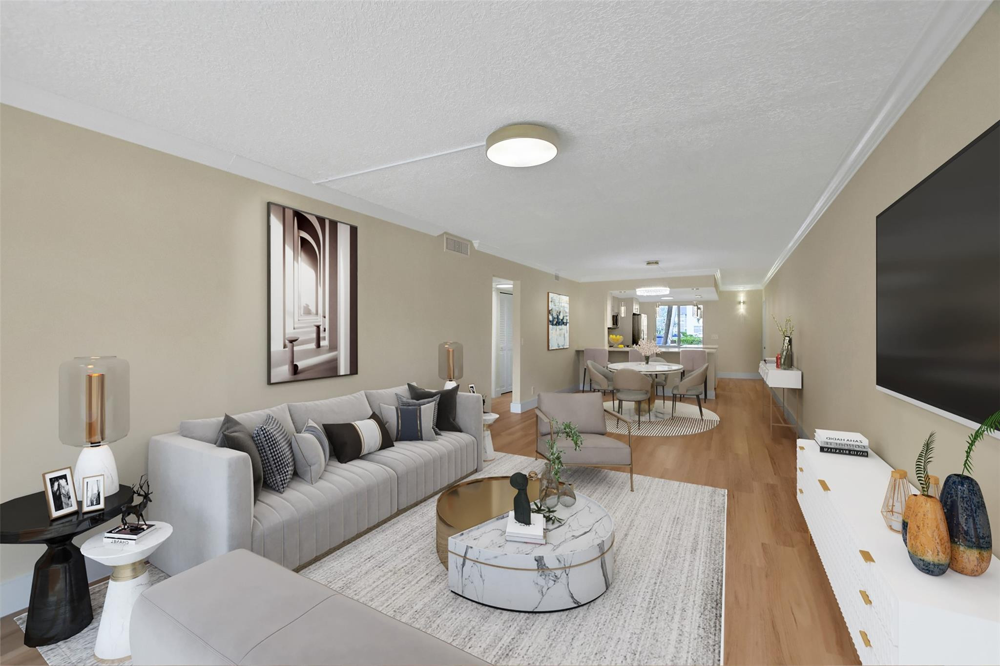 1019 Guildford East, Unit 1019 Boca Raton, FL 33434 - Photo 20 of 38 a living room with furniture and a flat screen tv