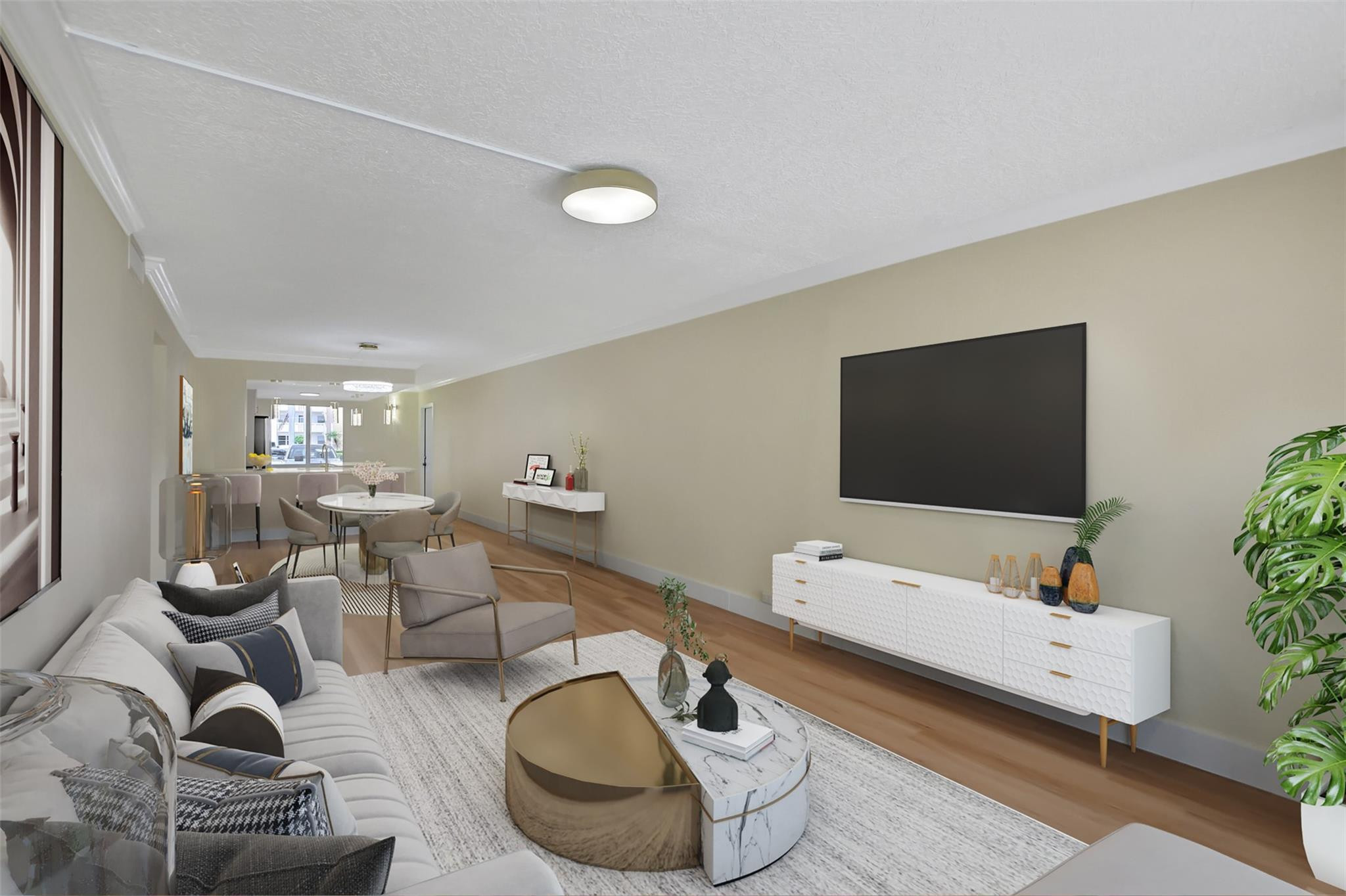 1019 Guildford East, Unit 1019 Boca Raton, FL 33434 - Photo 21 of 38 a living room with furniture and a flat screen tv