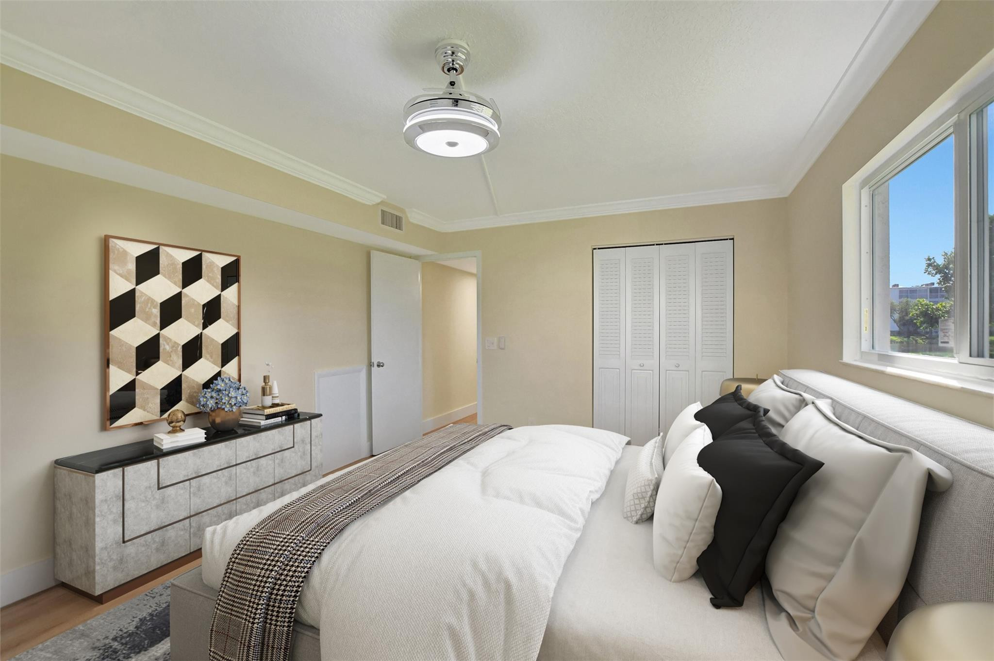 1019 Guildford East, Unit 1019 Boca Raton, FL 33434 - Photo 24 of 38 a bedroom with a bed and a window