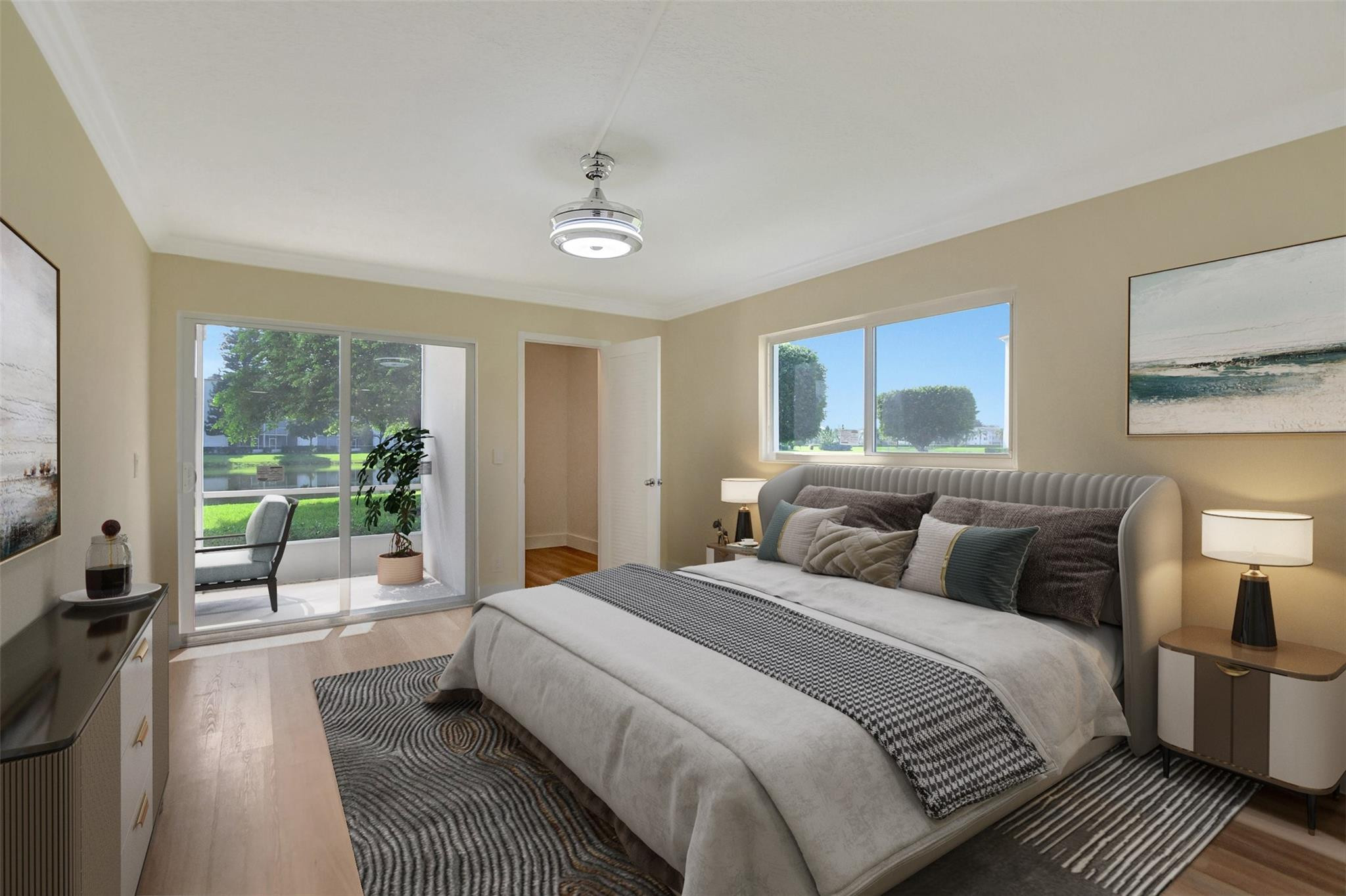 1019 Guildford East, Unit 1019 Boca Raton, FL 33434 - Photo 27 of 38 a bedroom with double bed and a large window