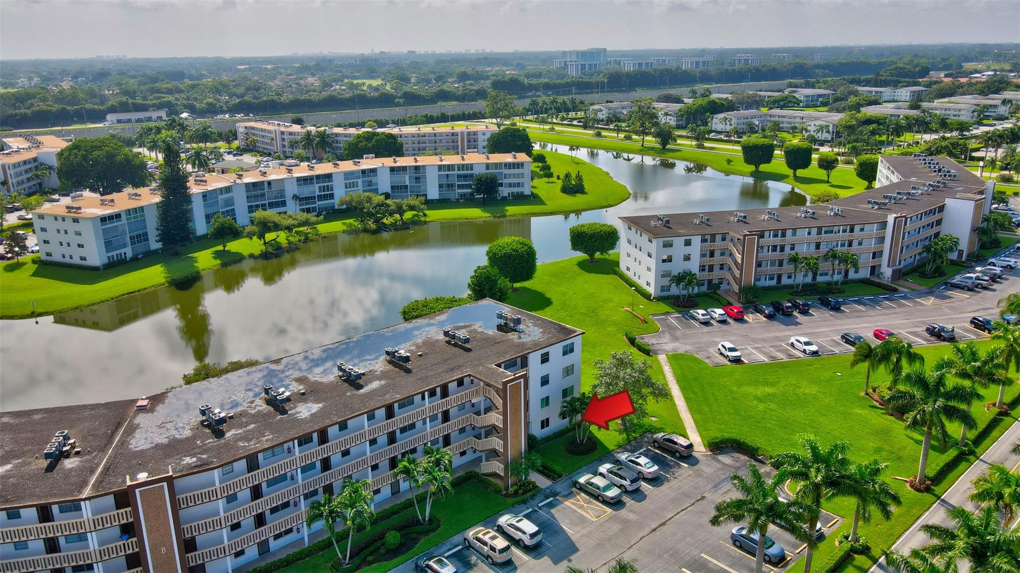 1019 Guildford East, Unit 1019 Boca Raton, FL 33434 - Photo 5 of 38 a city view with tall buildings