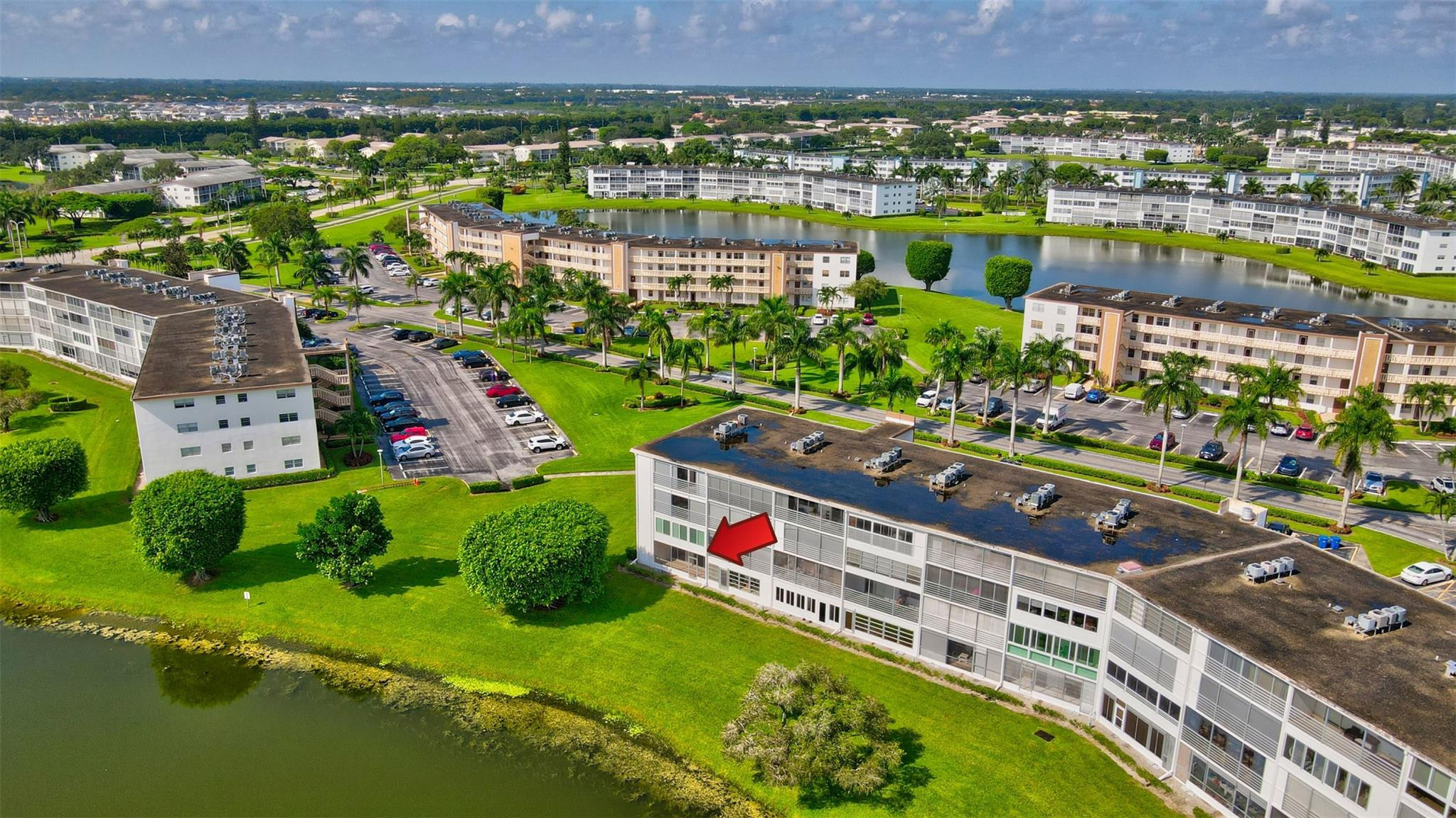 1019 Guildford East, Unit 1019 Boca Raton, FL 33434 - Photo 8 of 38 an aerial view of multiple house