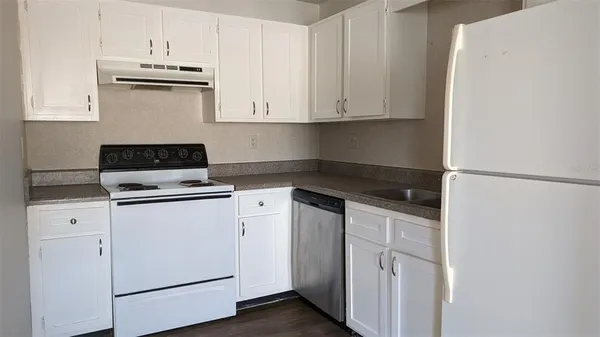 a bathroom with a sink a toilet and bathtub