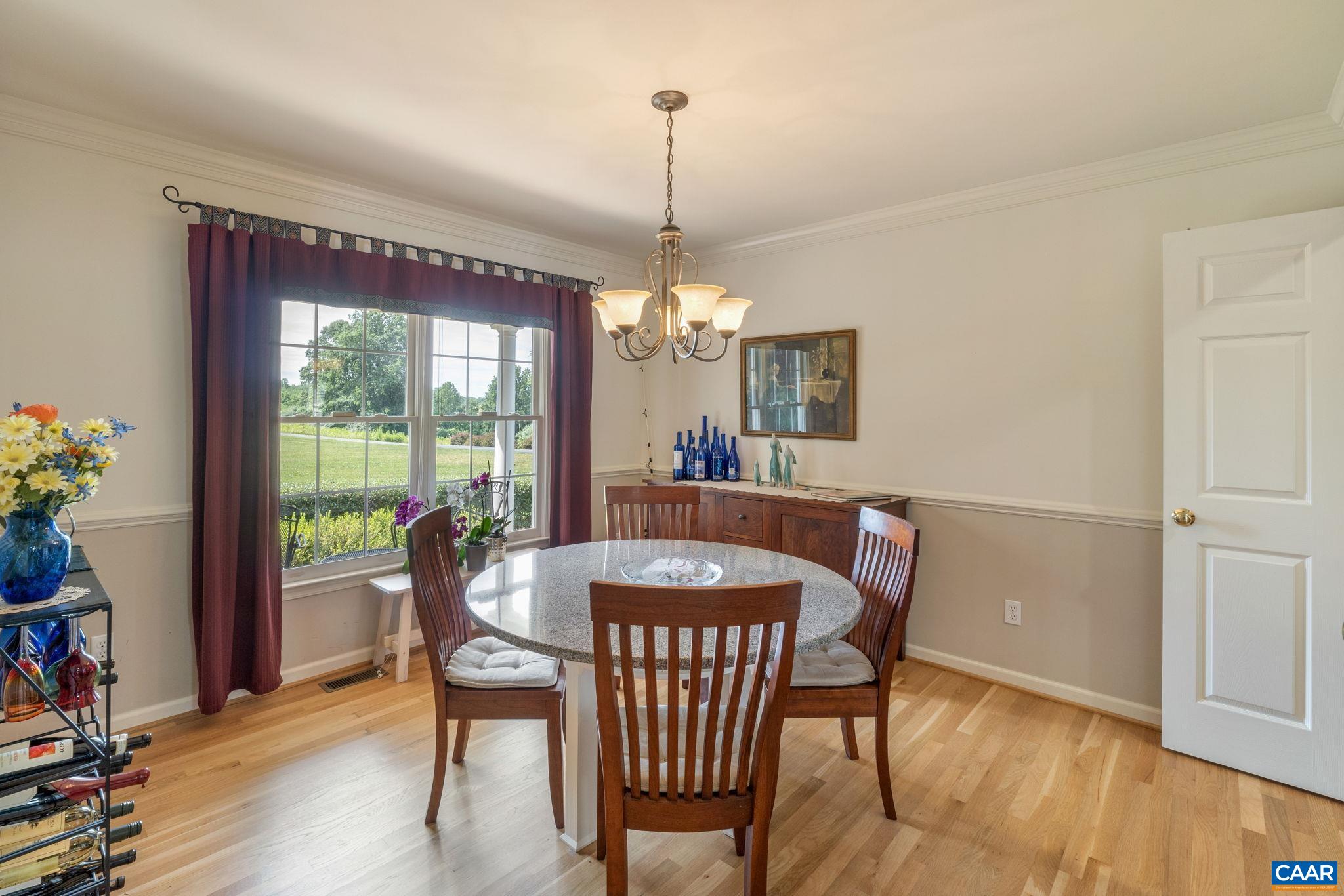 1900 Fray Road Advance Mills, VA 22968 - Photo 16 of 59 a dining room with furniture window and wooden floor
