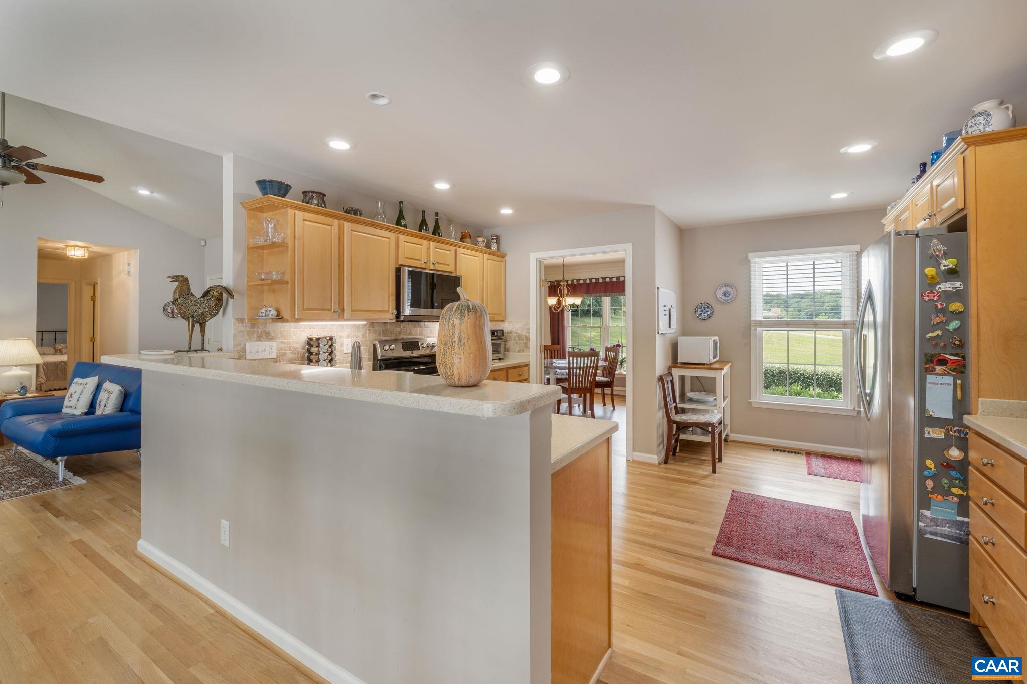 1900 Fray Road Advance Mills, VA 22968 - Photo 24 of 59 a living room with stainless steel appliances furniture a rug and a view of kitchen