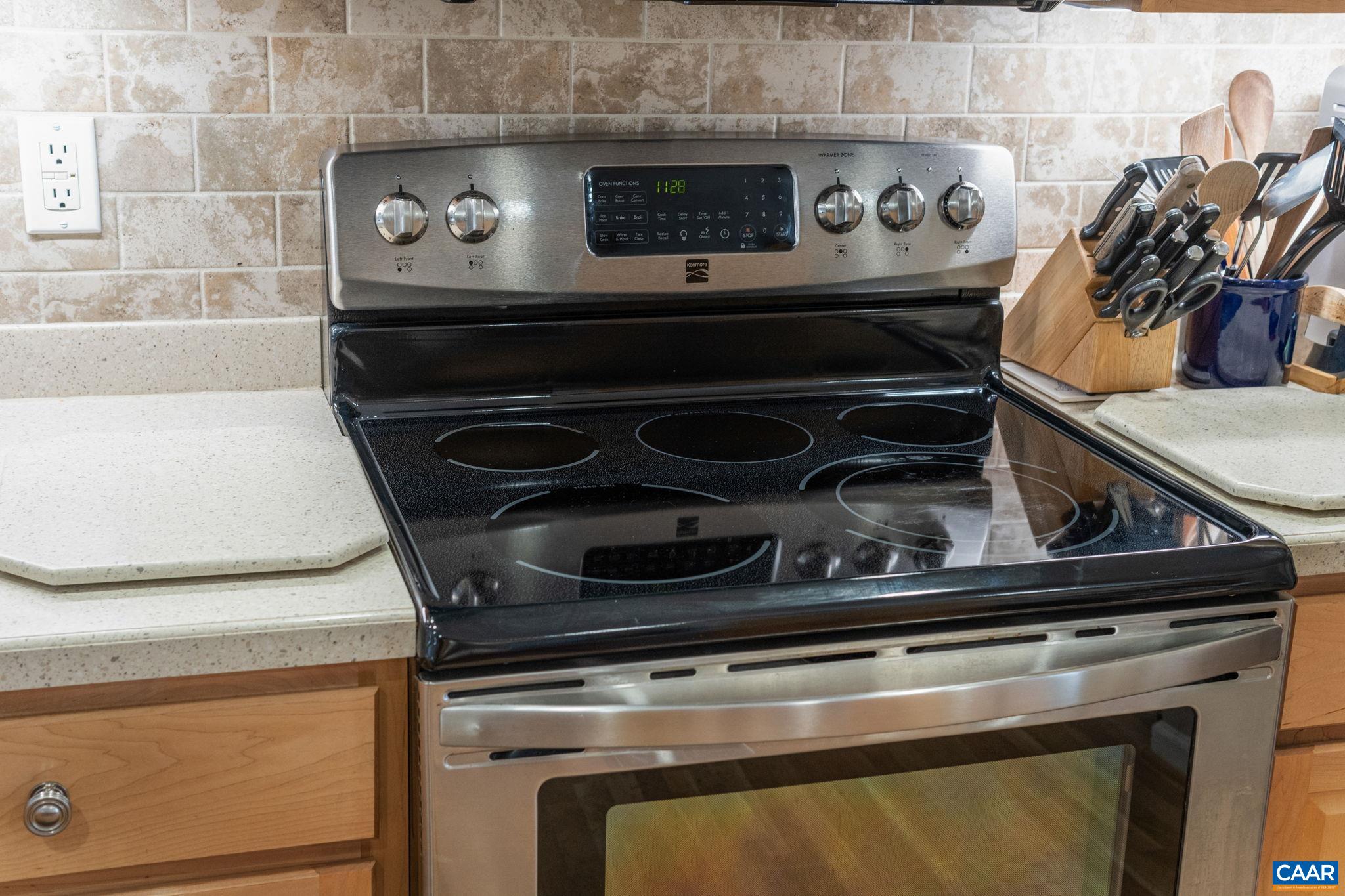 1900 Fray Road Advance Mills, VA 22968 - Photo 27 of 59 a stove top oven sitting inside of a kitchen with granite countertop