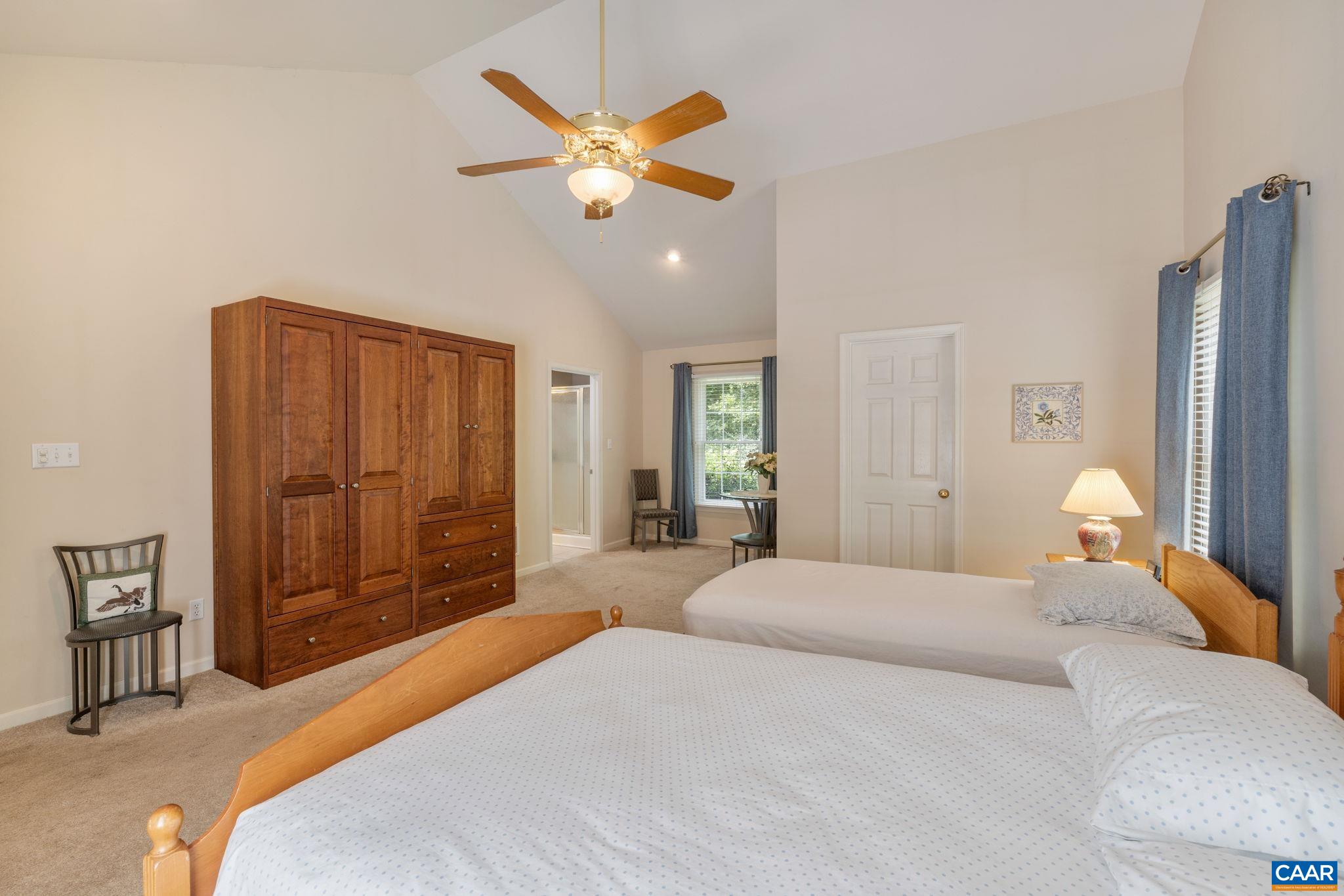 1900 Fray Road Advance Mills, VA 22968 - Photo 36 of 59 a bedroom with a large bed and a chandelier
