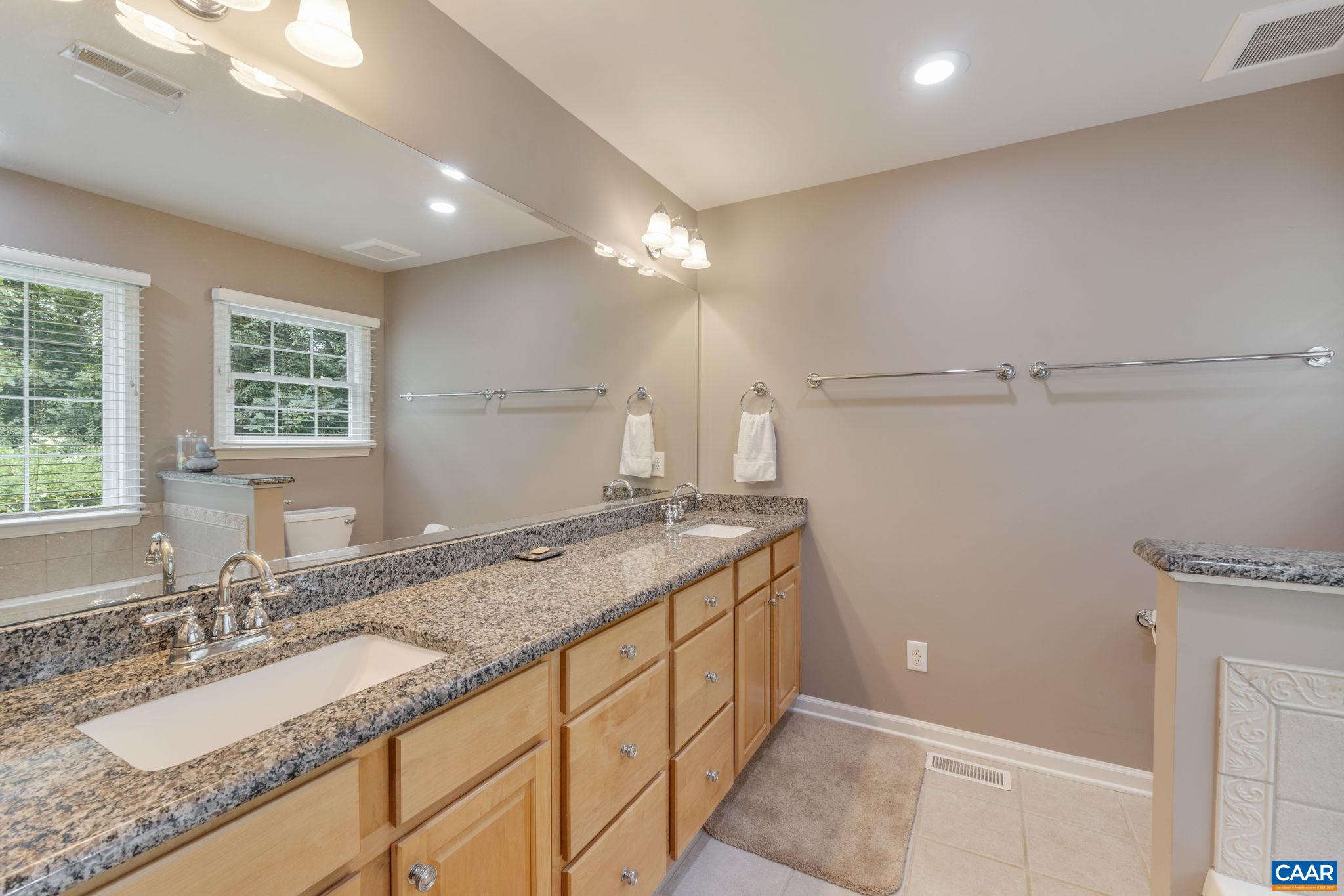 1900 Fray Road Advance Mills, VA 22968 - Photo 40 of 59 a bathroom with a granite countertop sink and a mirror