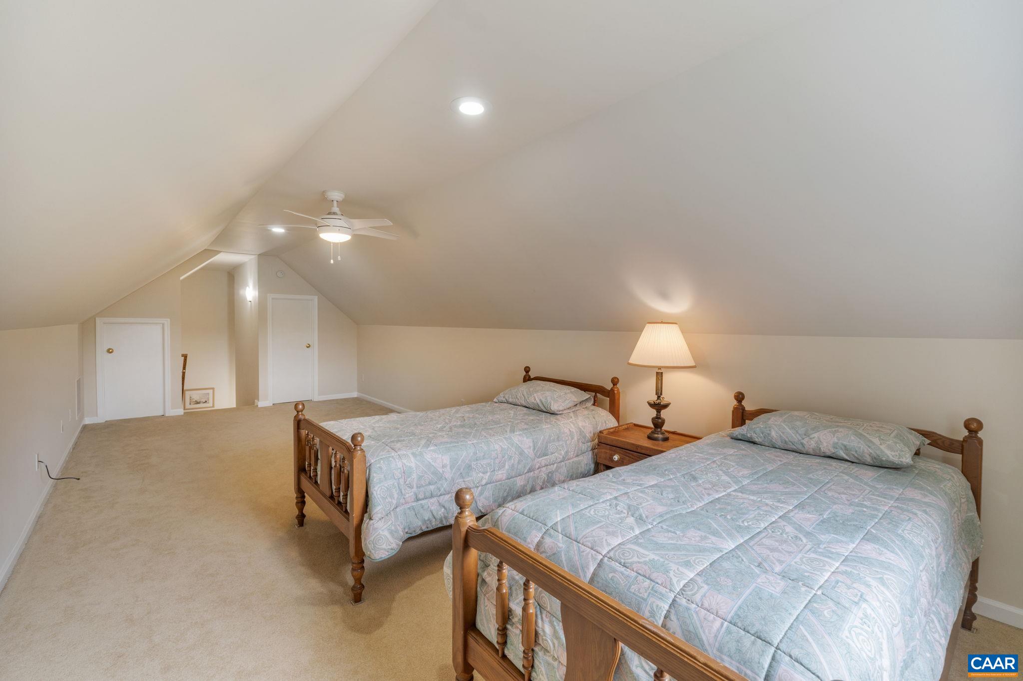 1900 Fray Road Advance Mills, VA 22968 - Photo 49 of 59 a bedroom with two beds and painted walls