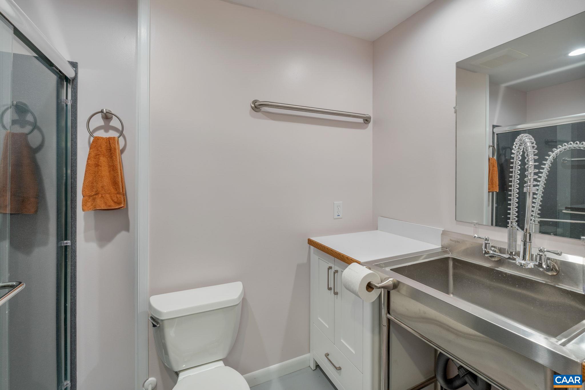 1900 Fray Road Advance Mills, VA 22968 - Photo 53 of 59 a bathroom with a sink toilet and mirror