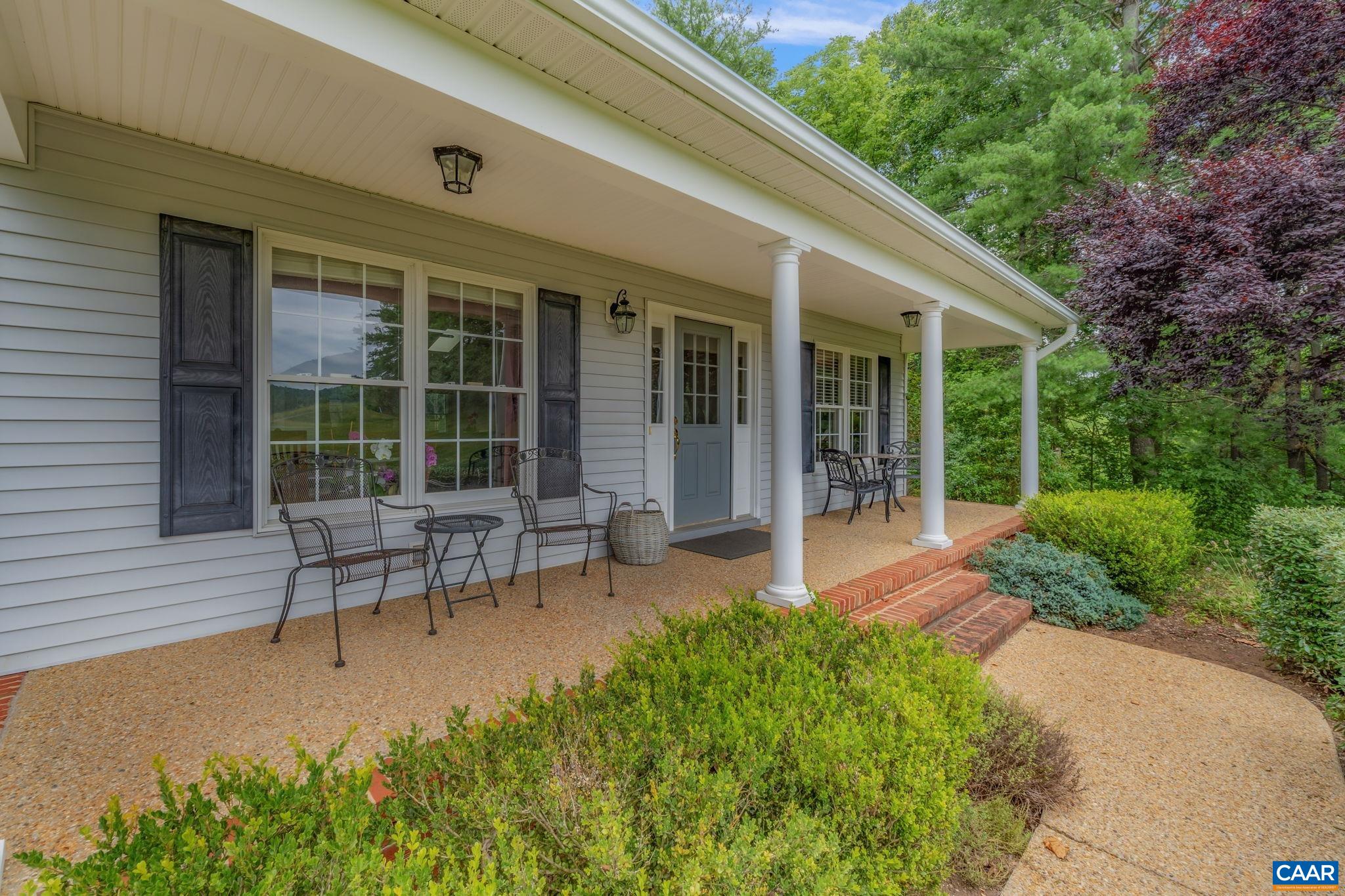 1900 Fray Road Advance Mills, VA 22968 - Photo 7 of 59 a view of a house with backyard sitting area and garden