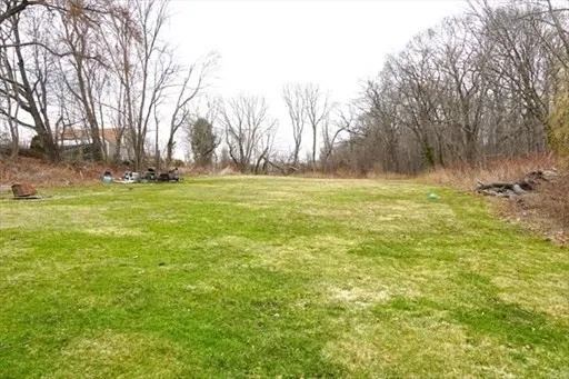 a view of outdoor space with trees all around