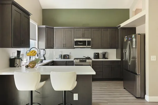 a kitchen with a sink and cabinets