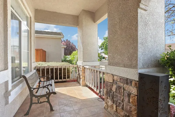 a view of a balcony with furniture