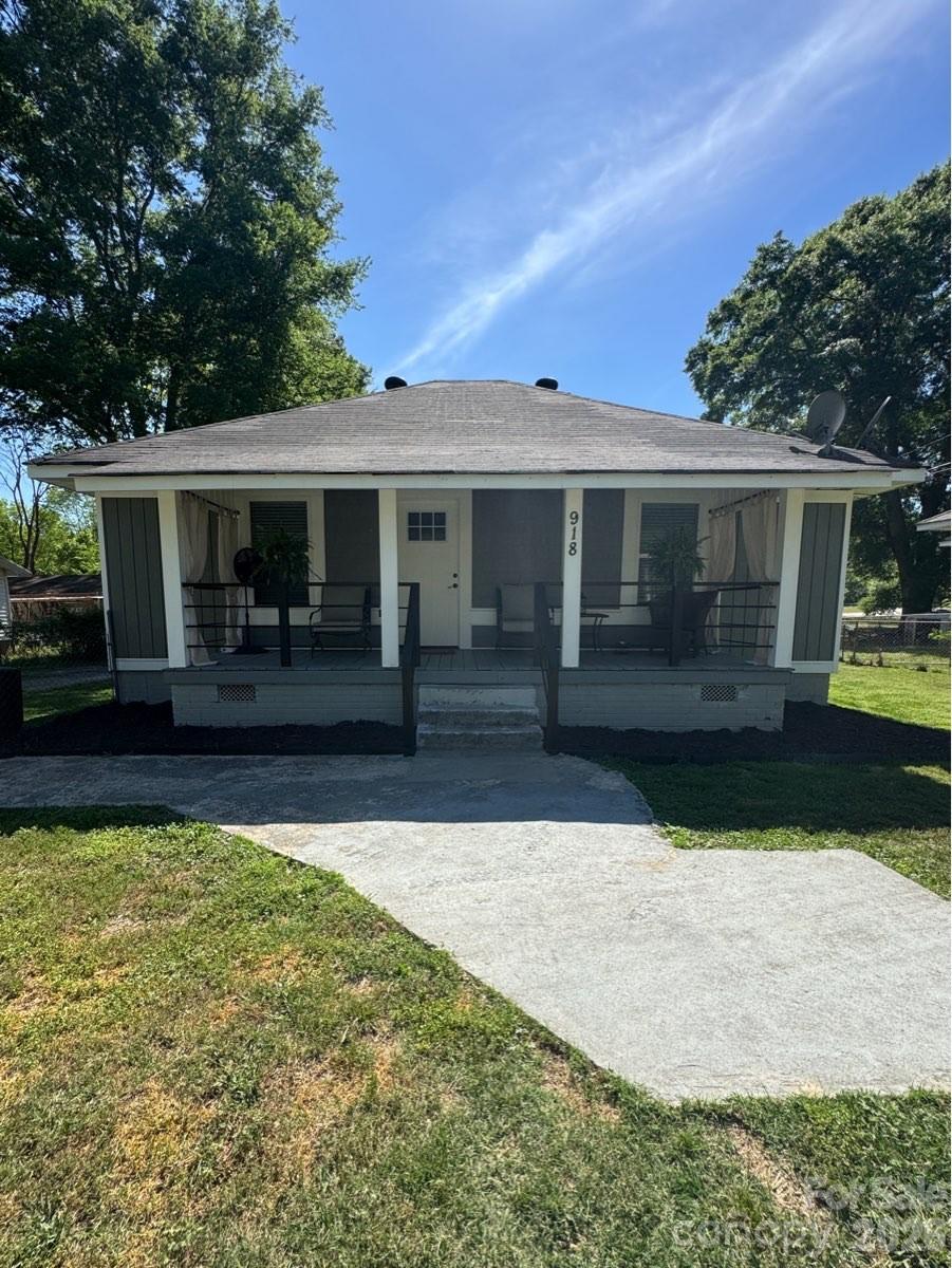 a front view of house with yard patio and green space