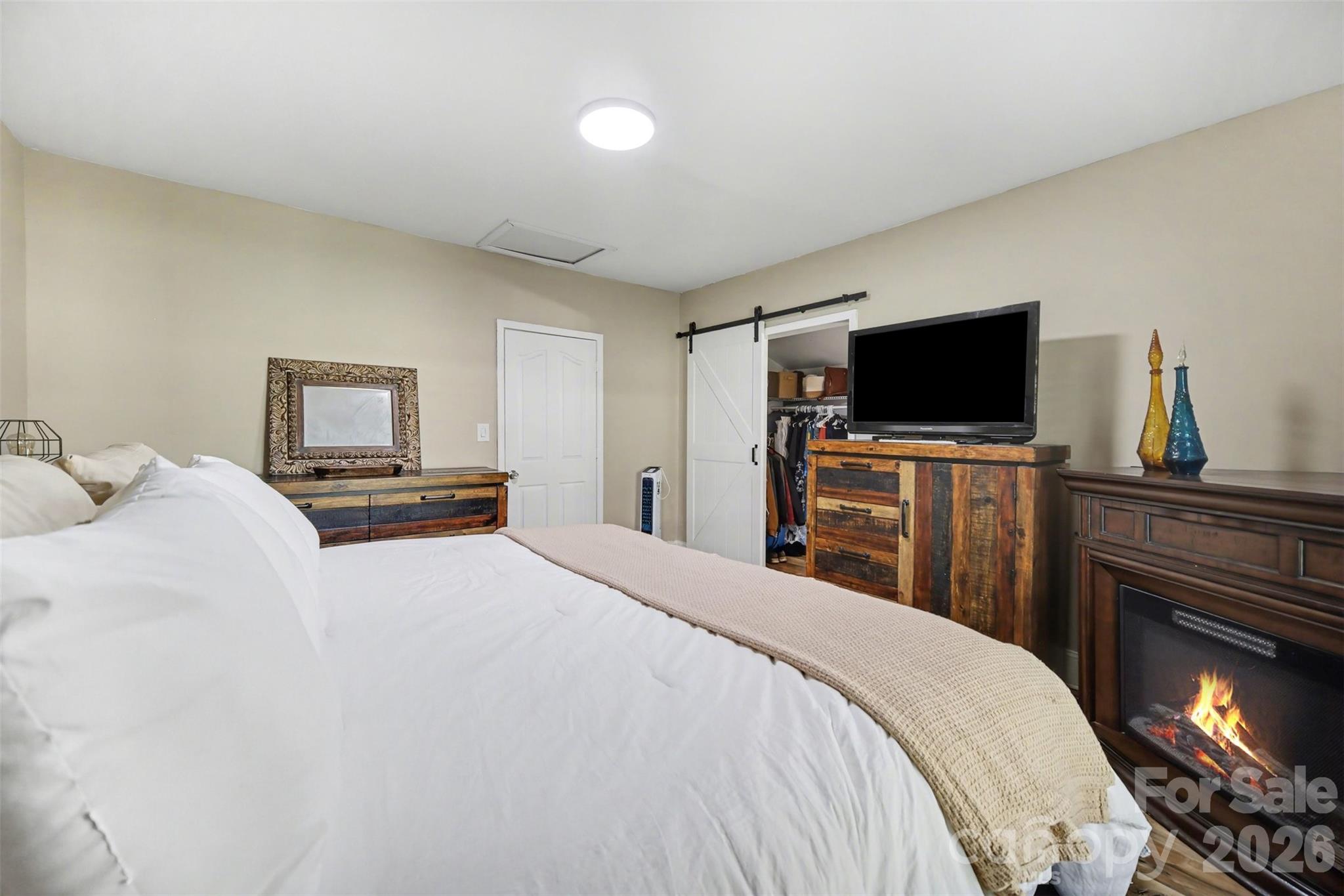 918 8th Street Lancaster, SC 29720 - Photo 23 of 32 a bedroom with a bed and a flat screen tv
