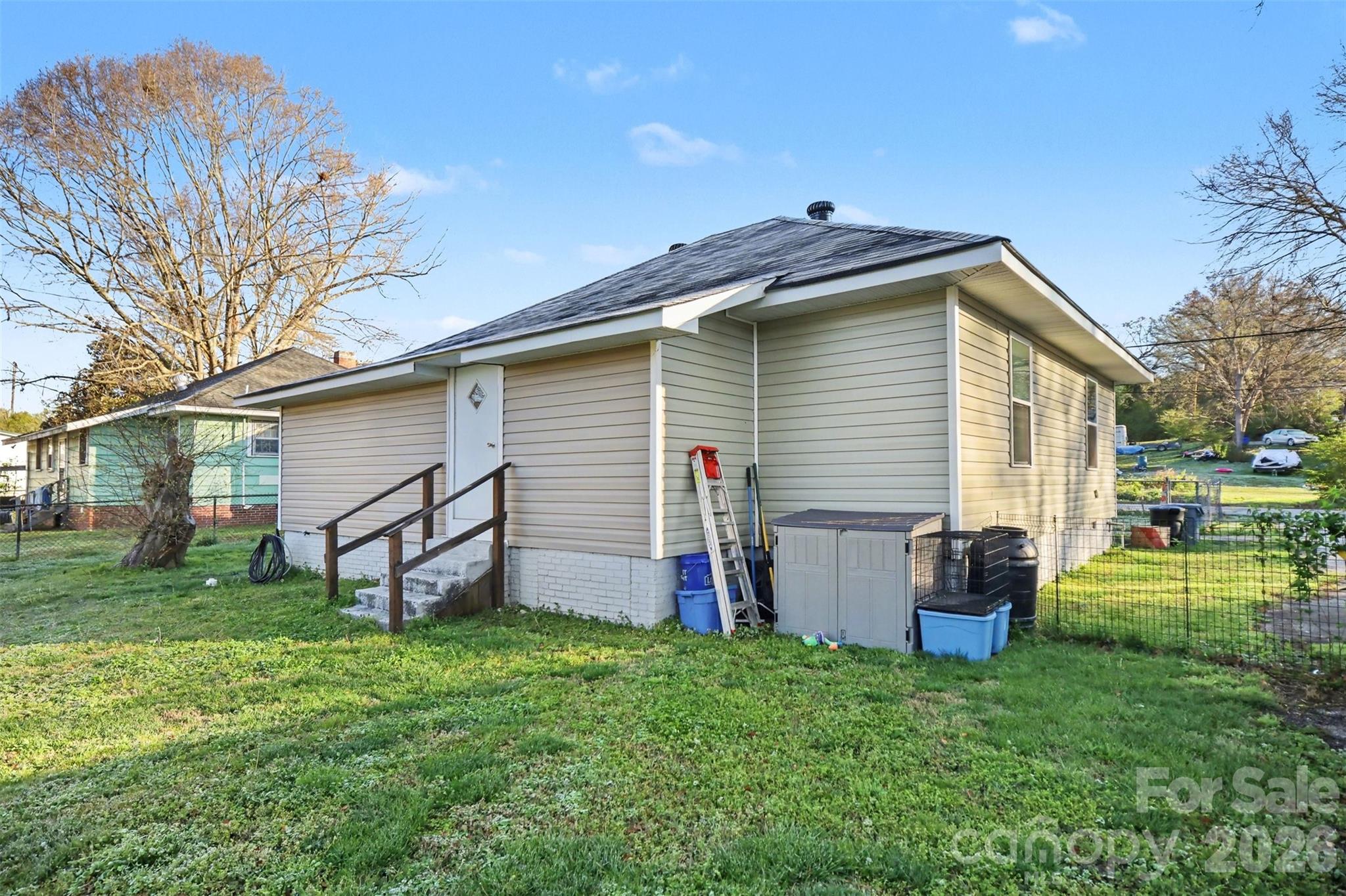918 8th Street Lancaster, SC 29720 - Photo 29 of 32 a view of backyard with wooden fence and a large tree