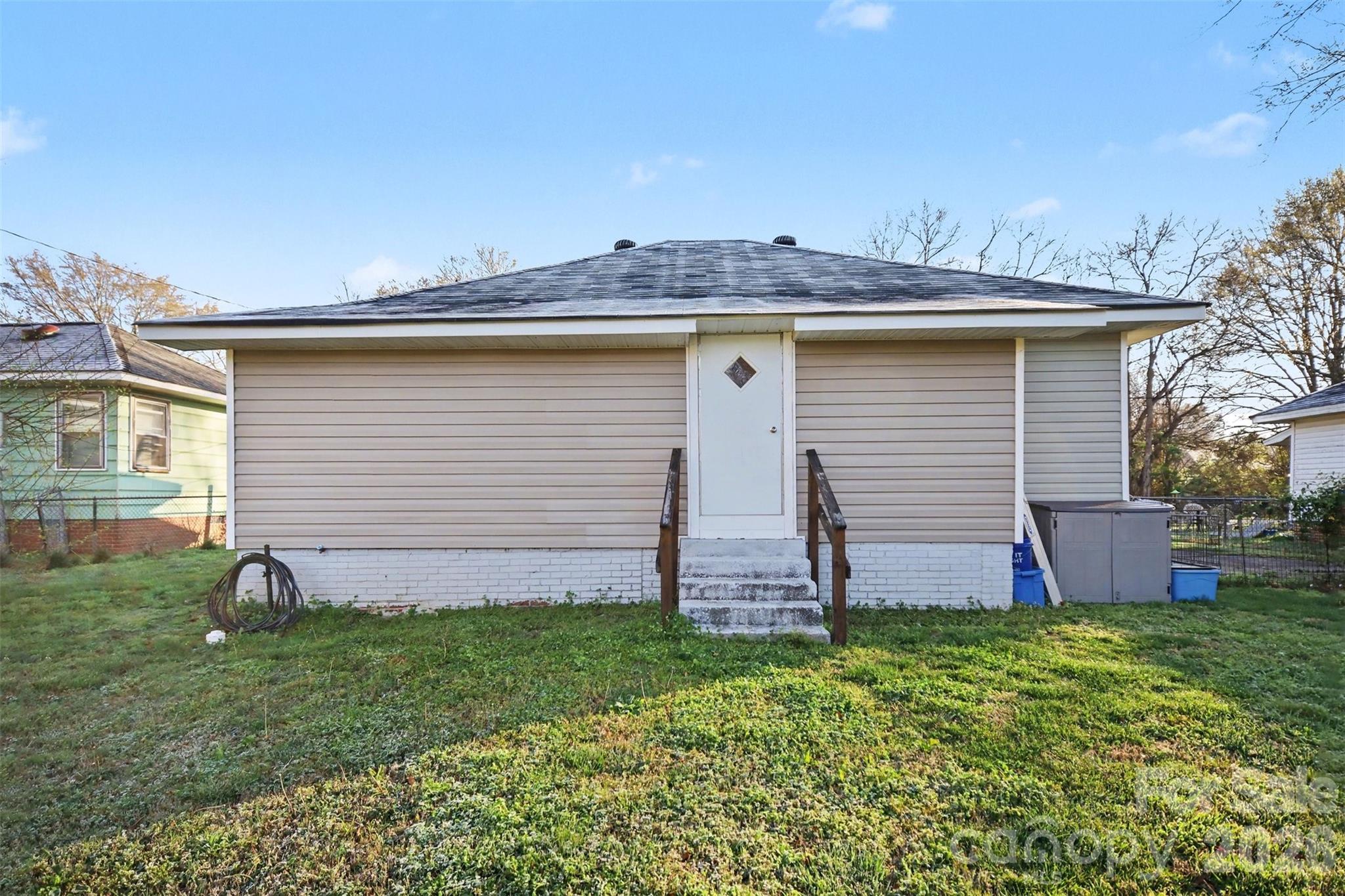 918 8th Street Lancaster, SC 29720 - Photo 30 of 32 a view of a backyard with potted plants