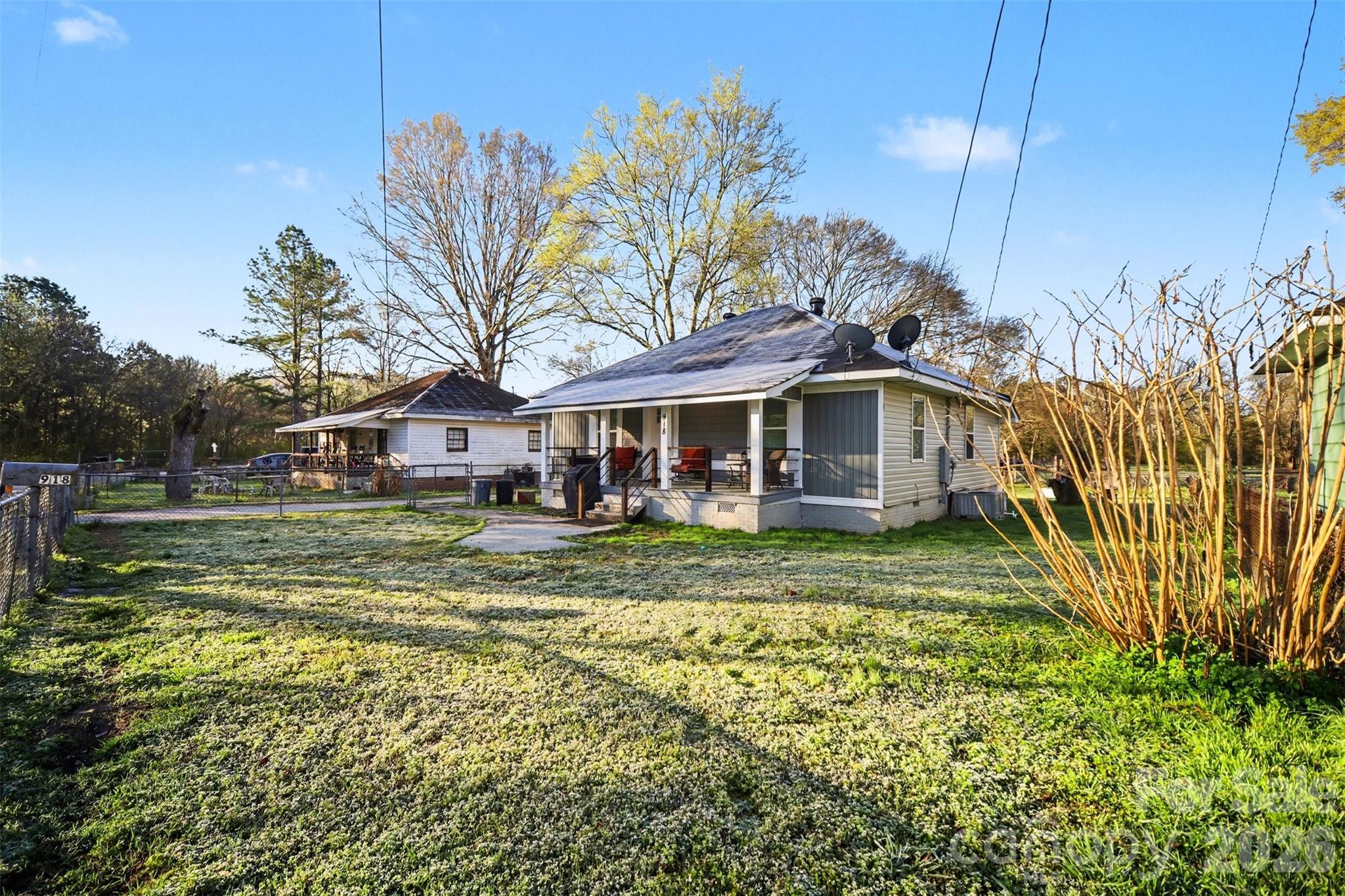 918 8th Street Lancaster, SC 29720 - Photo 32 of 32 a front view of a house with a yard table and chairs