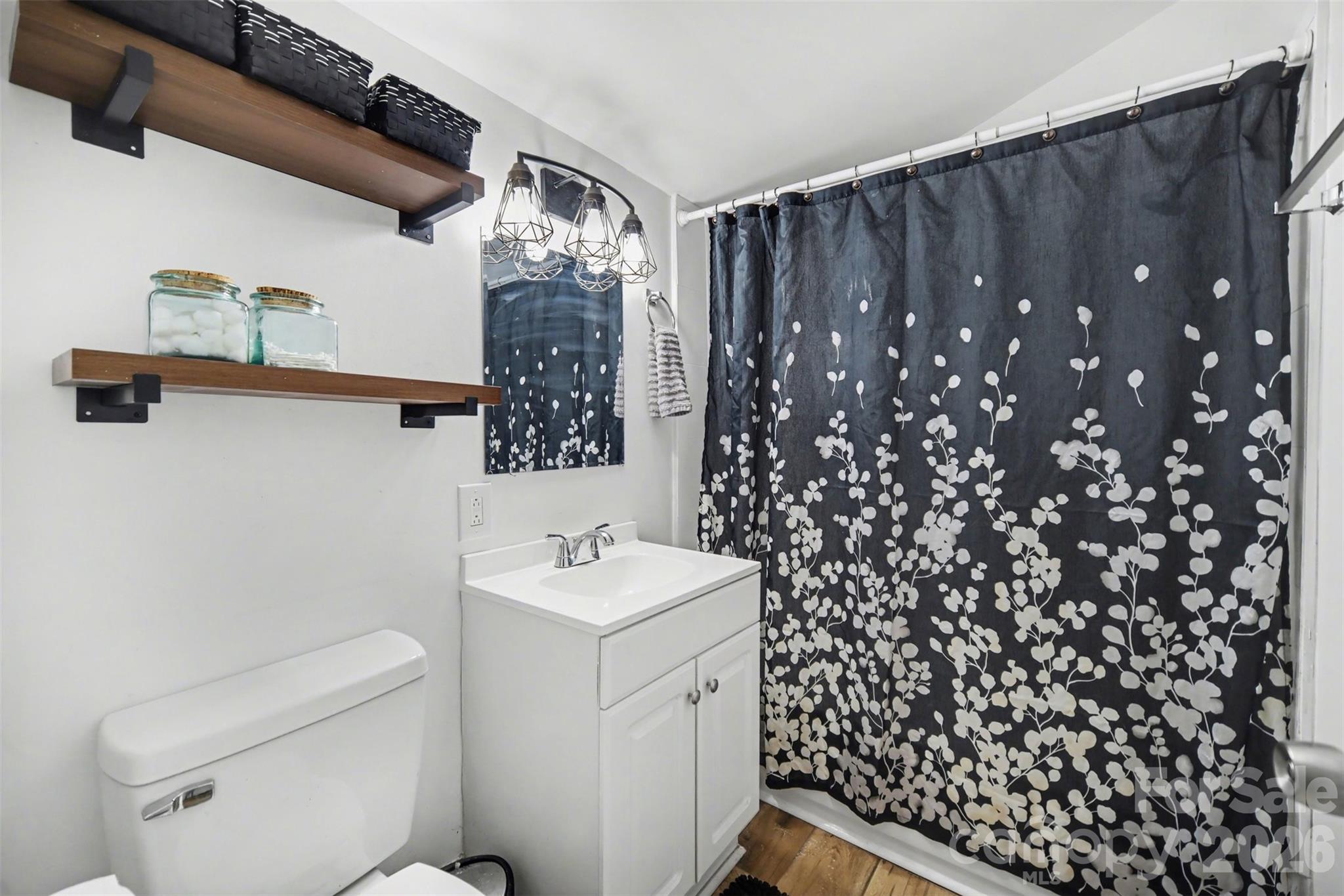 918 8th Street Lancaster, SC 29720 - Photo 8 of 32 a bathroom with a sink toilet and shower