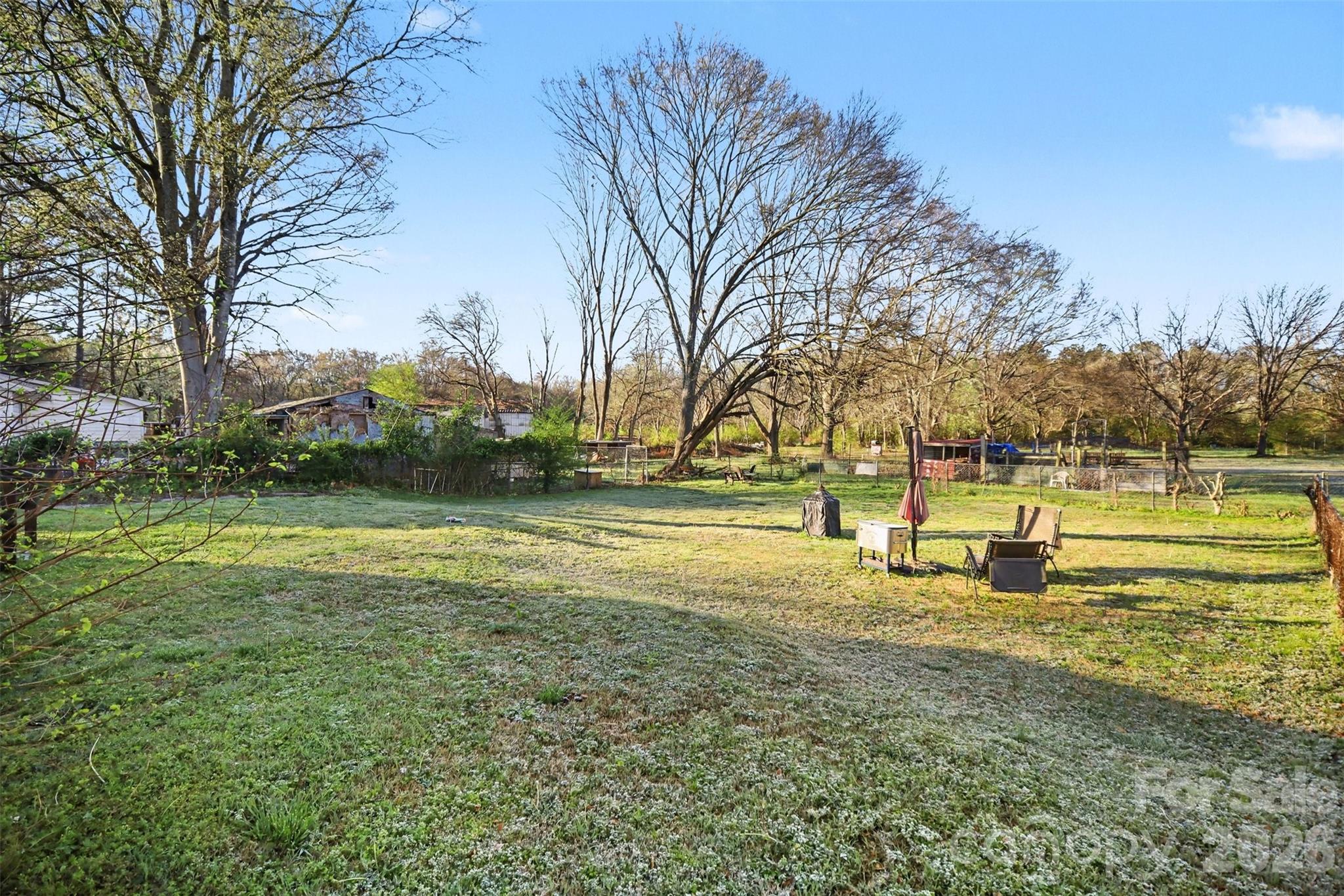 918 8th Street Lancaster, SC 29720 - Photo 9 of 32 a view of yard with swimming pool and trees