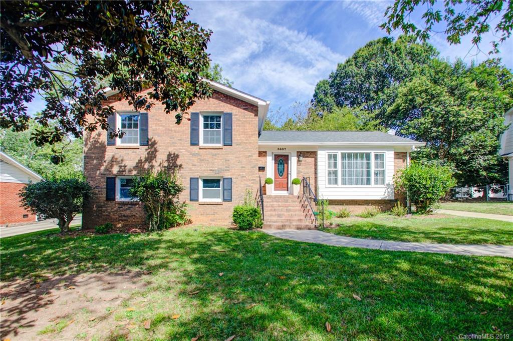 3607 Round Oak Road Charlotte, NC 28210 - Photo 2 of 36 a front view of a house with a yard and garden