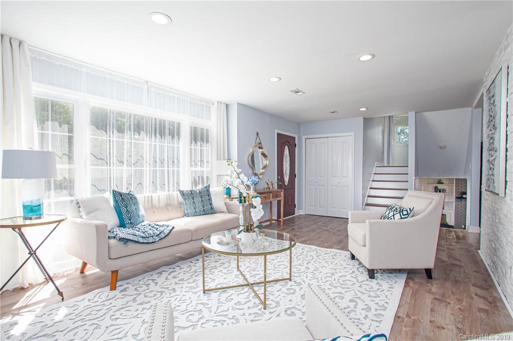 3607 Round Oak Road Charlotte, NC 28210 - Photo 14 of 36 a living room with furniture and wooden floor