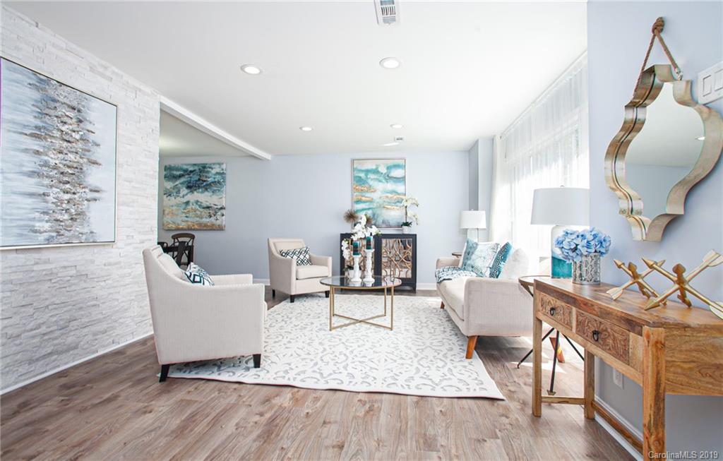 3607 Round Oak Road Charlotte, NC 28210 - Photo 15 of 36 a living room with fireplace furniture and a wooden floor