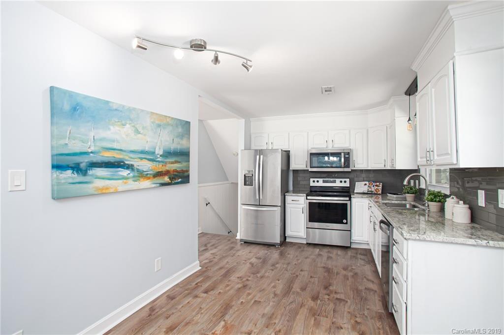 3607 Round Oak Road Charlotte, NC 28210 - Photo 20 of 36 a kitchen with stainless steel appliances a refrigerator and a stove top oven