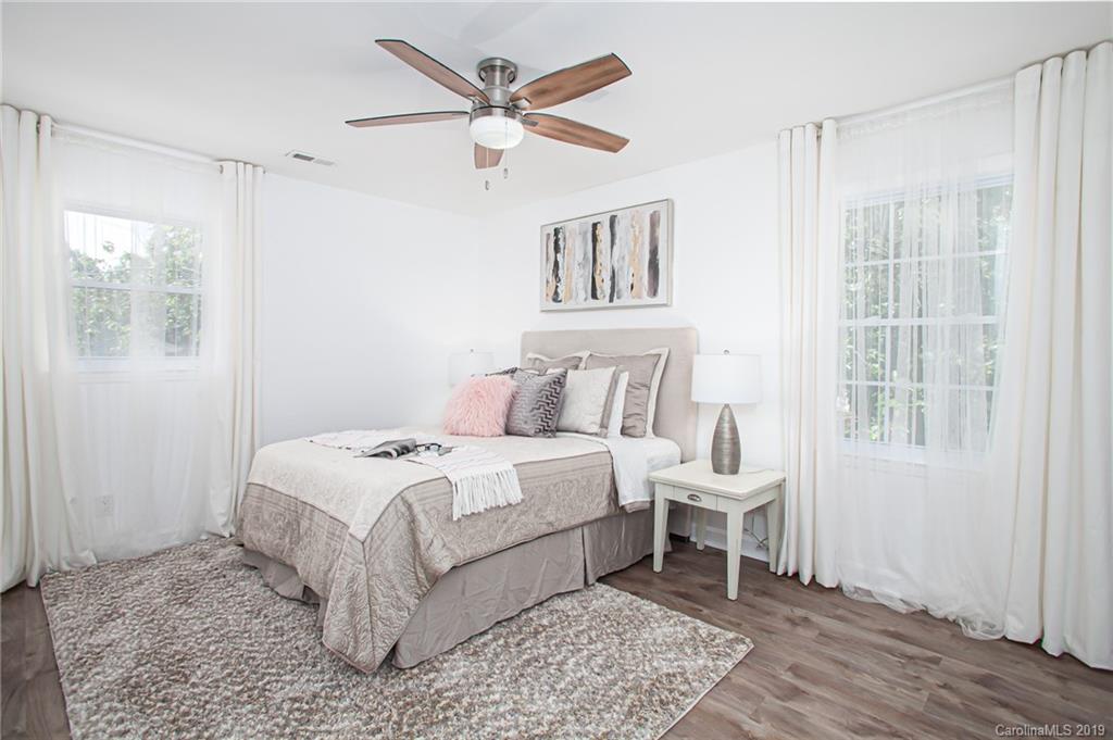 3607 Round Oak Road Charlotte, NC 28210 - Photo 23 of 36 a bedroom with a large bed and a window