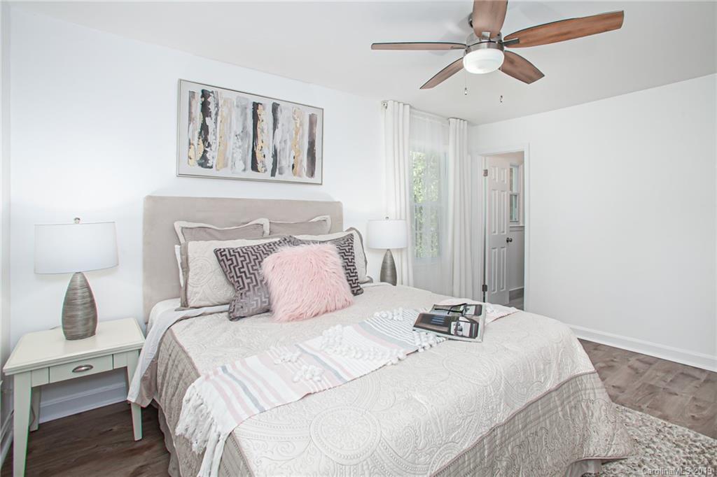 3607 Round Oak Road Charlotte, NC 28210 - Photo 24 of 36 a bedroom with a bed and a painting on the wall