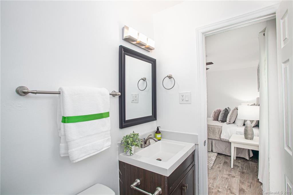 3607 Round Oak Road Charlotte, NC 28210 - Photo 30 of 36 a bathroom with a sink a mirror and a toilet