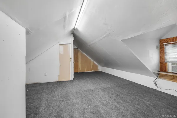 a view of an empty room with stairs