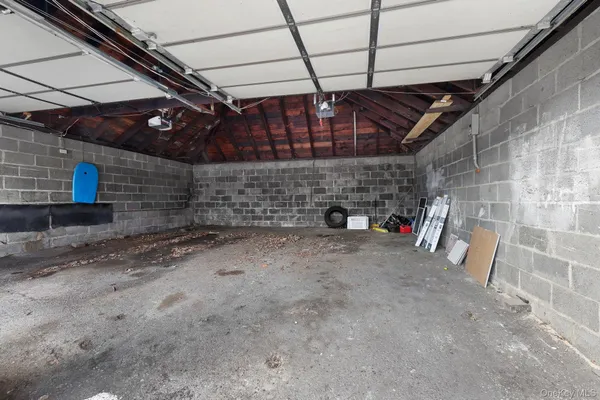 a view of empty room with wooden ceiling