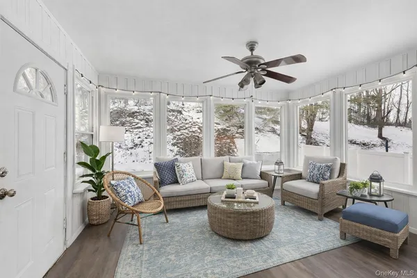 a living room with furniture and a large window