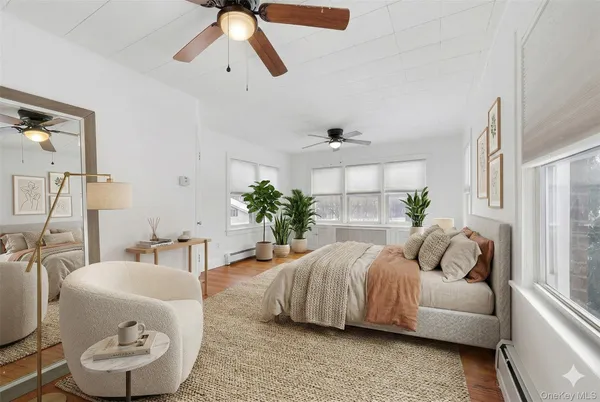 a bedroom with a bed and a couch